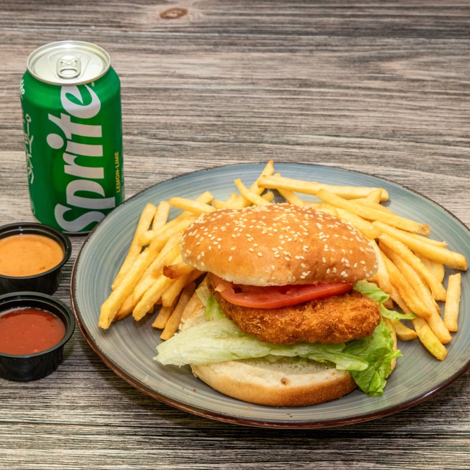 Chicken sandwich combo with fries and a drink.